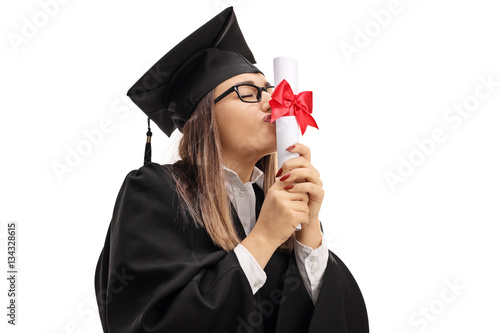 Graduate student kissing a diploma photo