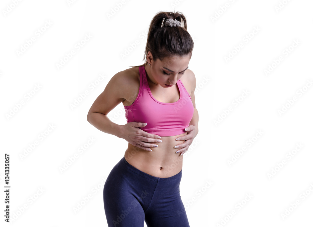 Fitness beautiful young girl touching her body and looking into Fitness beautiful young girl touching her body and looking into