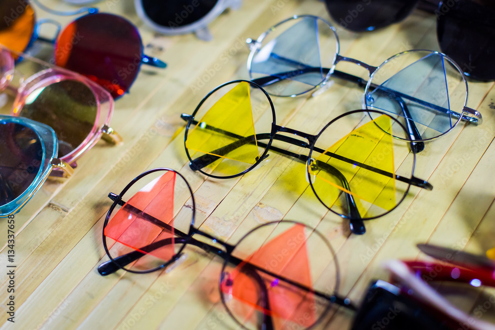 Fashion Sunglasses in shop. Unusual and original Collection of sunglasses.  Instagram Filter. Stock Photo | Adobe Stock