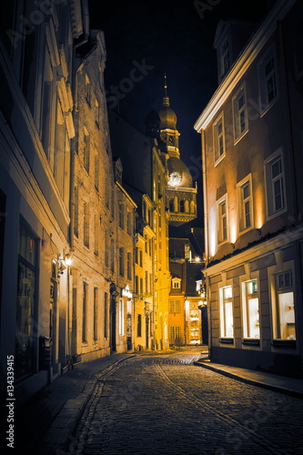 Night in old Riga - famous European city where tourists can find a unique atmosphere of Middle Ages