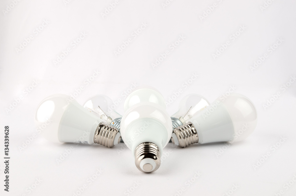 several LED energy saving light bulbs over the old incandescent, use of economical and environmentally friendly light bulb concept several LED energy saving light bulbs over the old incandescent, use of economical and environmentally friendly light bulb concept