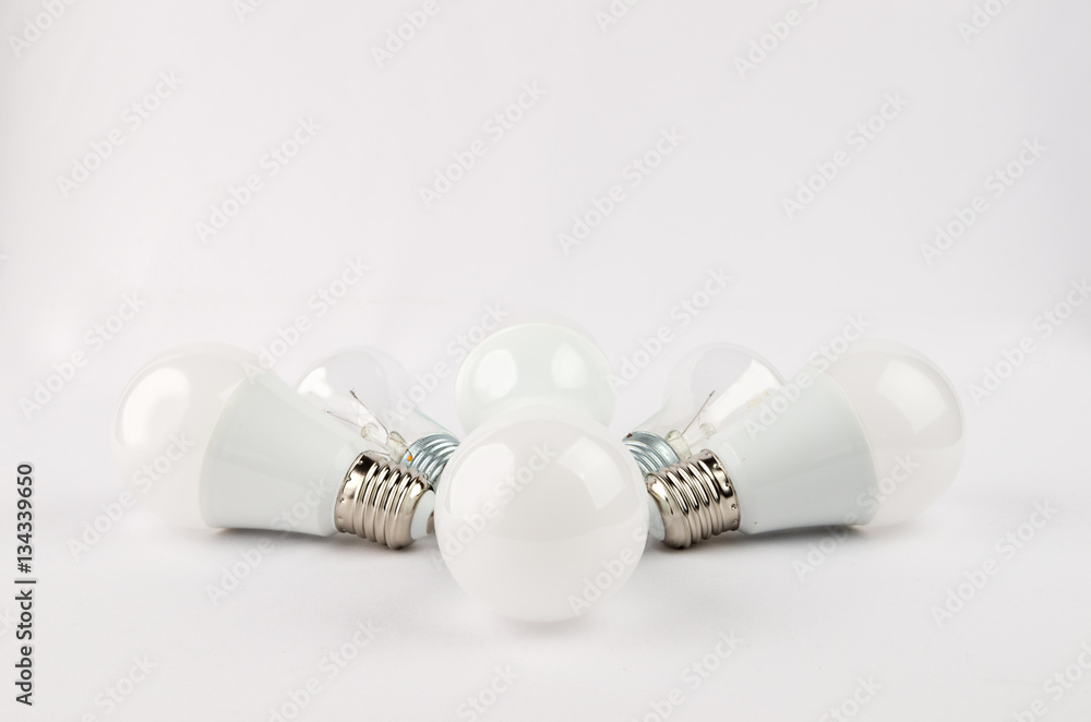 several LED energy saving light bulbs over the old incandescent, use of economical and environmentally friendly light bulb concept several LED energy saving light bulbs over the old incandescent, use of economical and environmentally friendly light bulb concept
