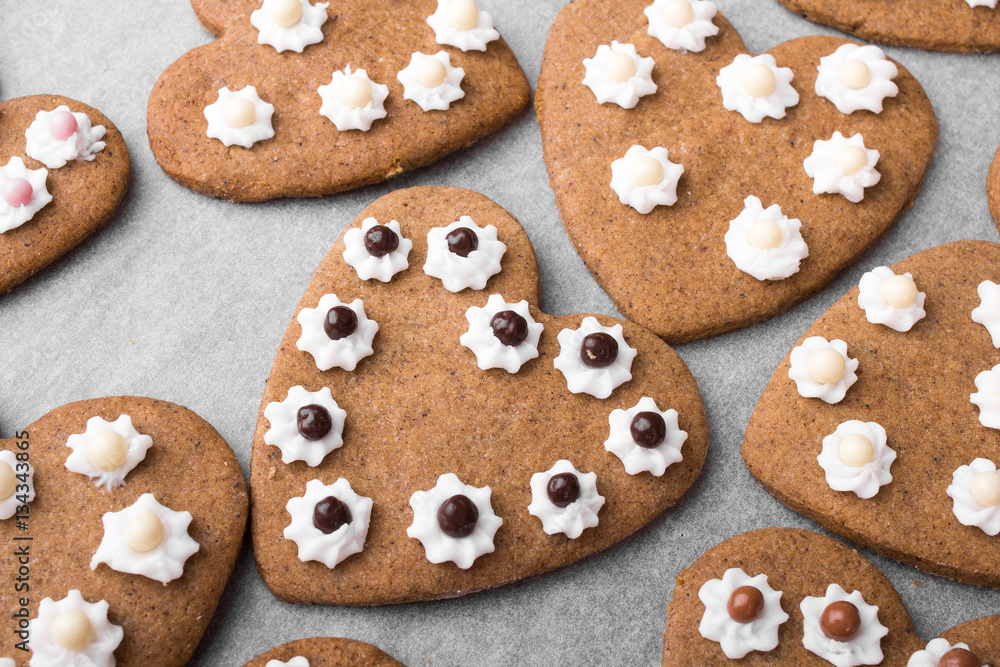 Heart shaped cookies on baking paper background