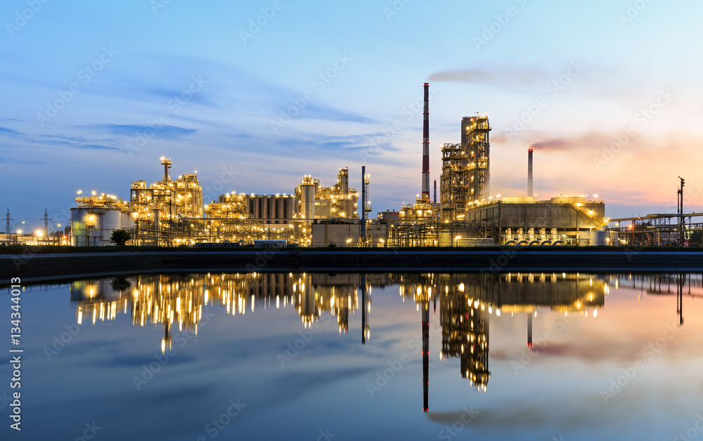 Highlighted oil refinery at sunset