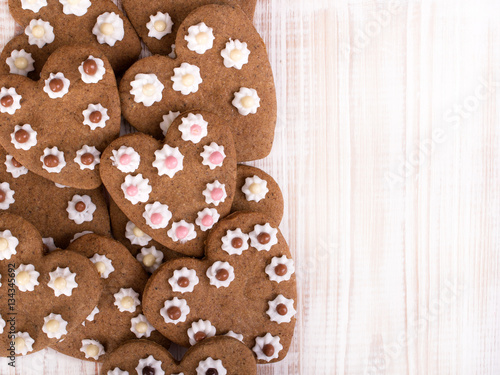 Heart shaped cookies on white wooden background