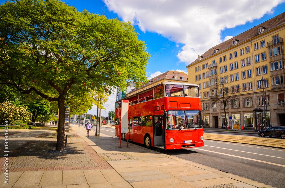 Classic red city sightseeing bus, Dresden, Saxony, Germany - obrazy, fototapety, plakaty 