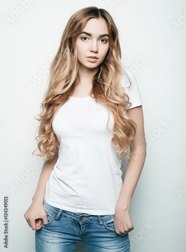 Young fashion model posing in studio