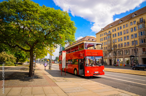 Classic red city sightseeing bus, Dresden, Saxony, Germany © Olena Zn