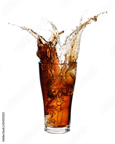 Cola splashing out of a glass., Isolated white background.