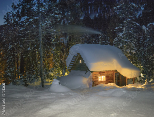 Taiga hut winter night. photo