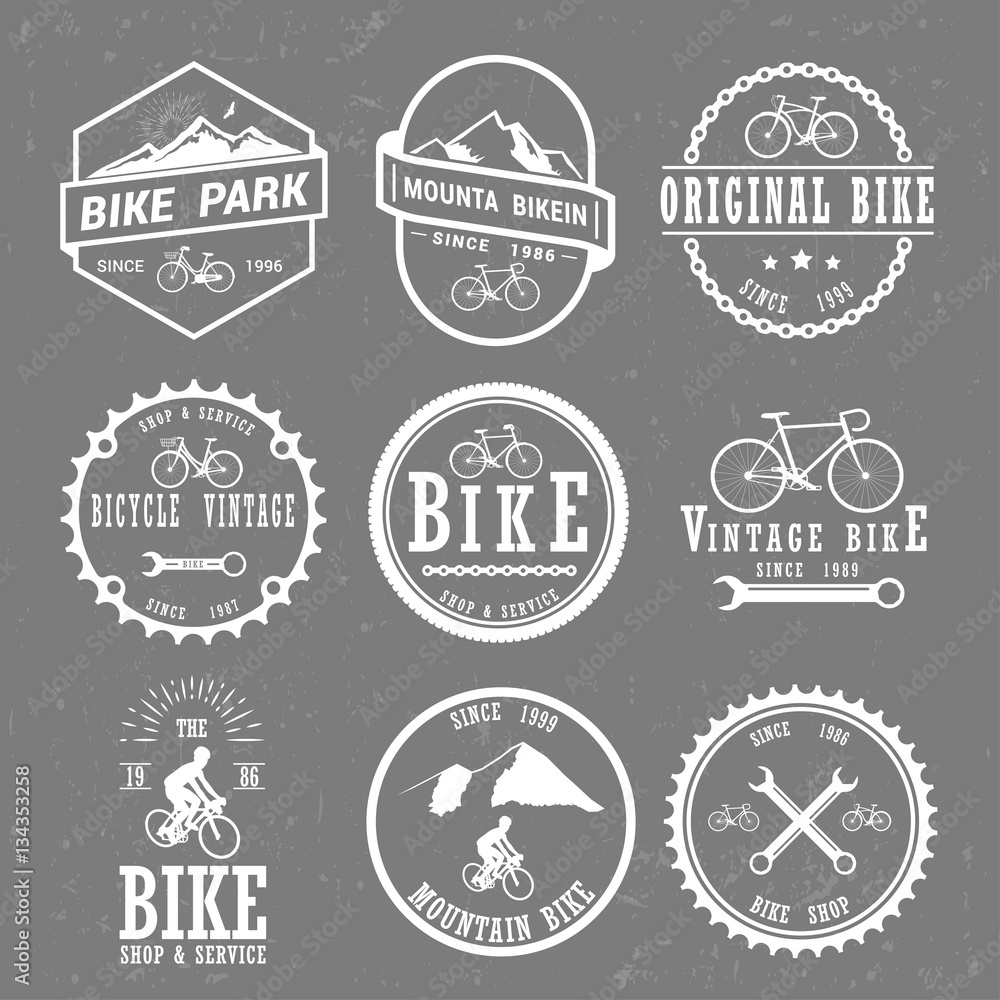 Set of vintage and modern bike shop logo badges and labels.