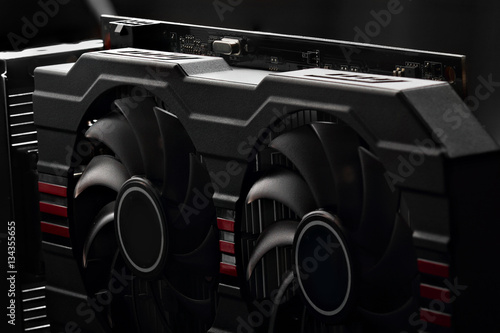 video card with two coolers on a dark background.concept computer harware photo