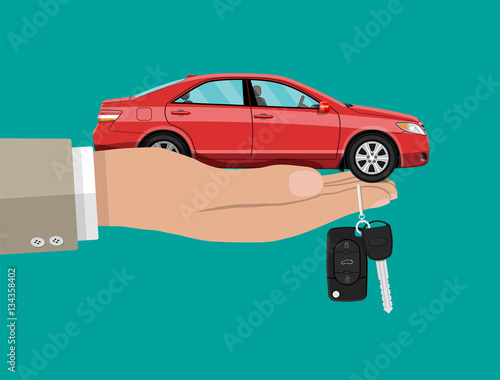 Hand with red car and keys