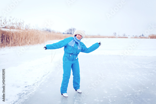 Smiling cheerful girl wearing warm clothing on white