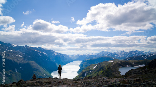 Young, blond woman hiking in Jotunheimen, Norway.