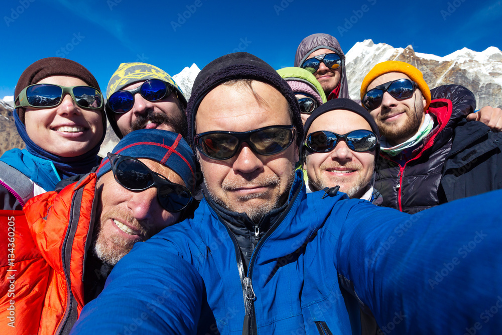 Portrait of Mountain Climbers Team happy to reach the Summit Portrait of Mountain Climbers Team happy to reach the Summit