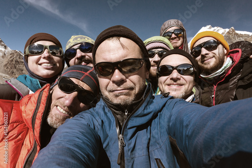 Self Portrait of Team of Mountain Climbers smiling and happy © alexbrylovhk