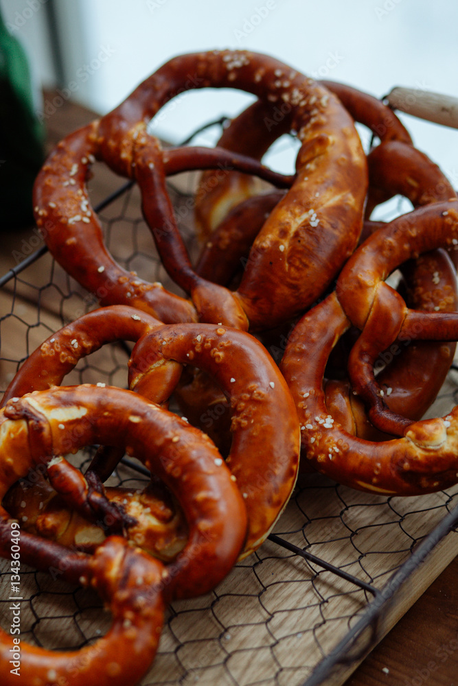 fresh pretzel in a metal basket fresh pretzel in a metal basket