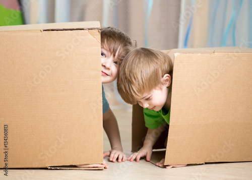 Child and toddler boys play...