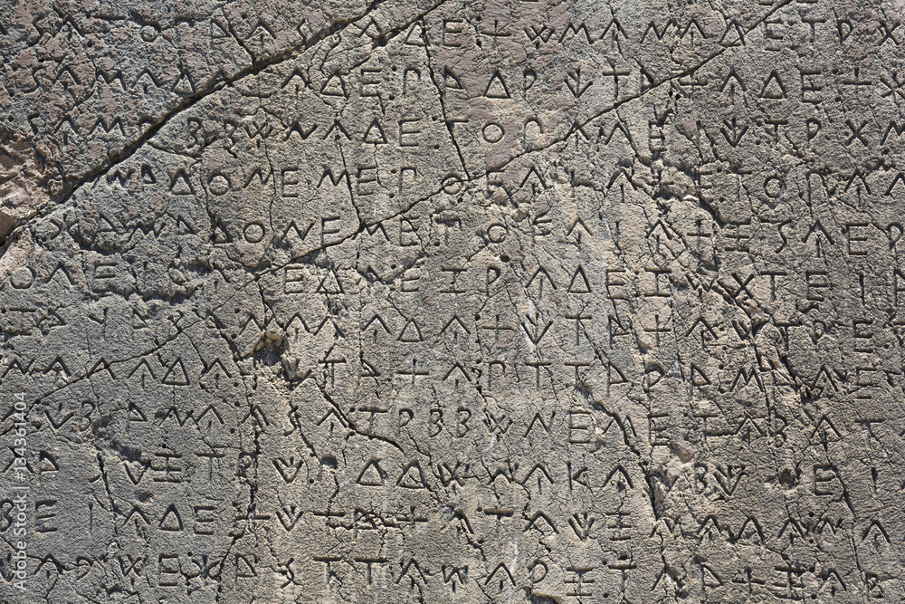 Obraz premium Macro view of script on Inscribed Pillar in Xanthos Ancient City