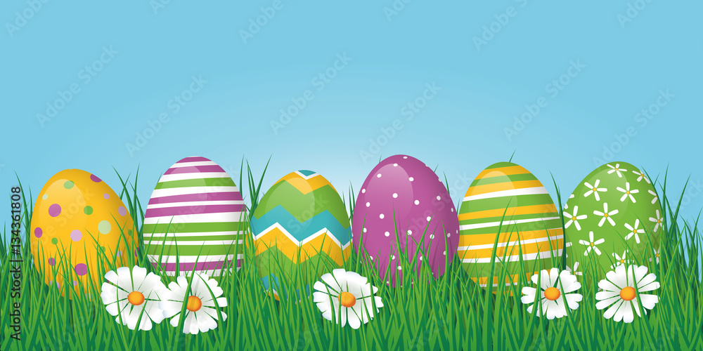 Easter border or banner with eggs in grass and copy space above