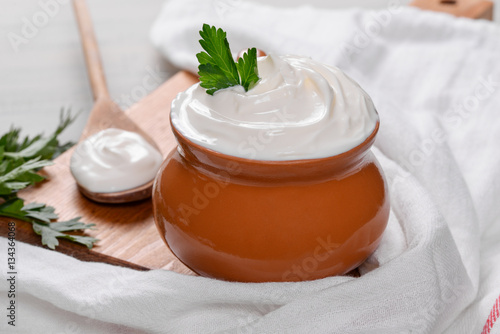Sour cream in a clay pot