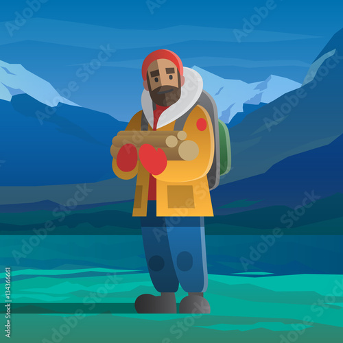 Man with logs in the winter mountains.