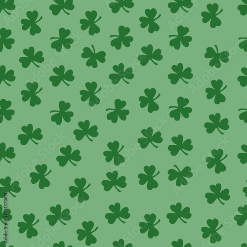 Seamless pattern with green clover silhouette. Nature background. Hand drawn vector illustration. St. Patrick's Day. Wrapping paper.