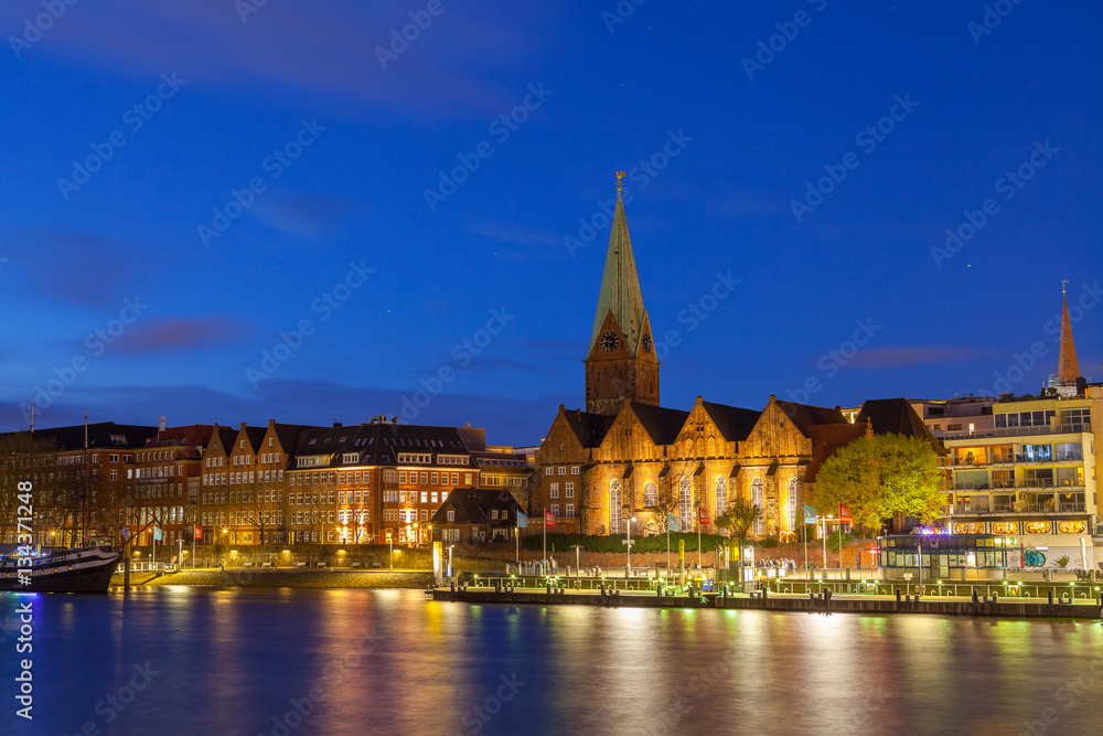 Cityscape of night old town over the Weser river