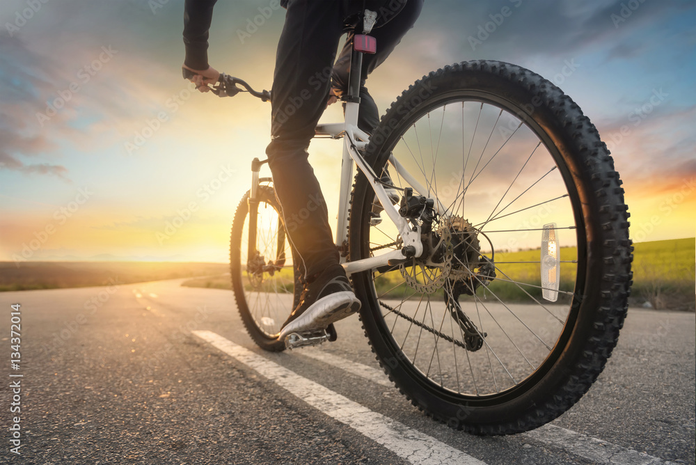 Ride on bike on the road. Sport and active life concept in the summer time Ride on bike on the road. Sport and active life concept in the summer time