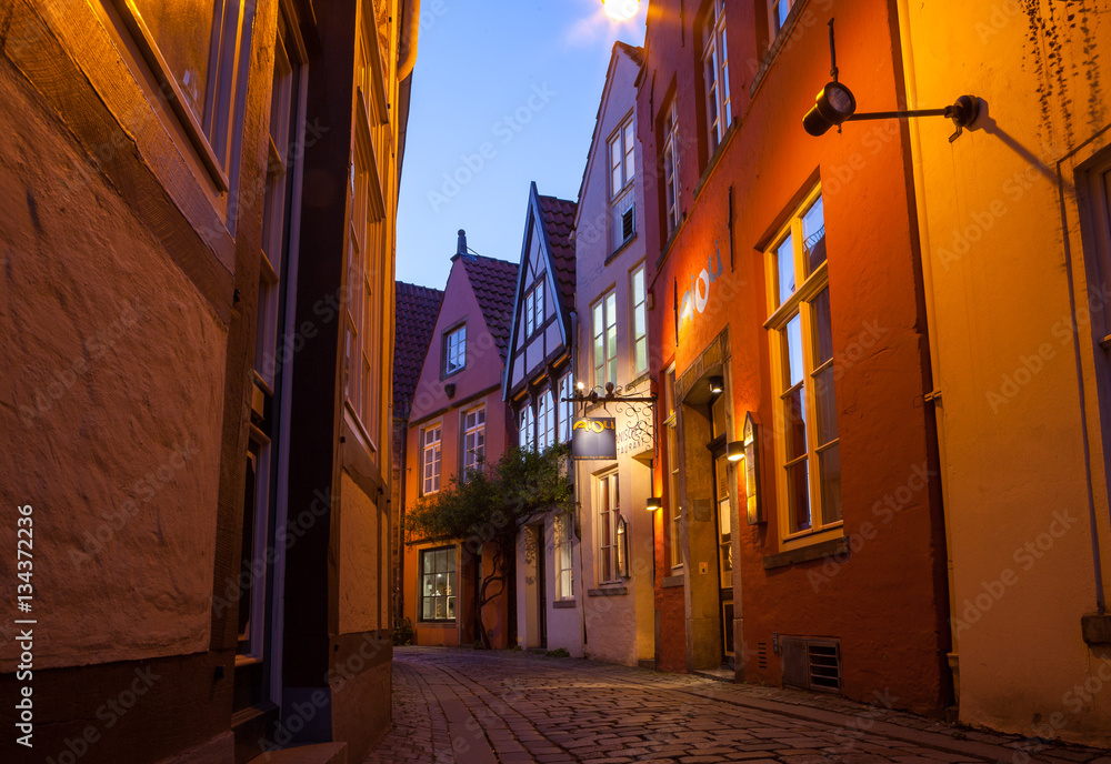 Historic streets of illuminated Schnoor quarter at night