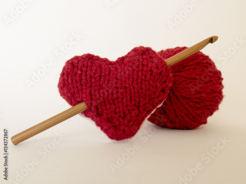 Background on the love knitting with wool and hook and heart