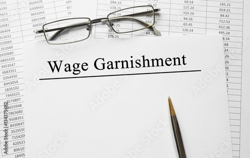 Foto Paper with Wage Garnishment on a table