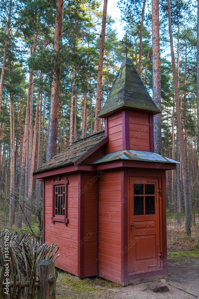 A small wooden chapel in the middle of the forest, Northern Europe A small wooden chapel in the middle of the forest, Northern Europe