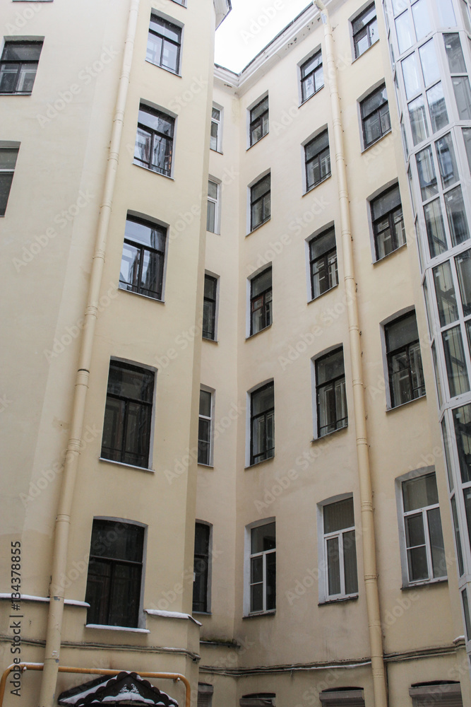 The walls of the city buildings in the yard.