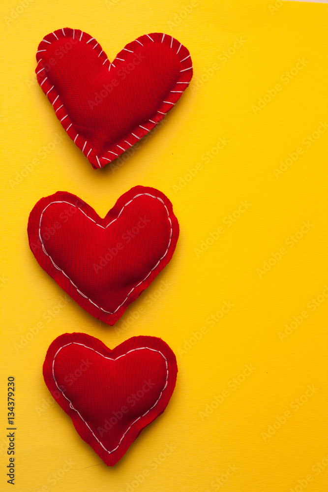 vertically arranged hearts on a yellow background vertically arranged hearts on a yellow background