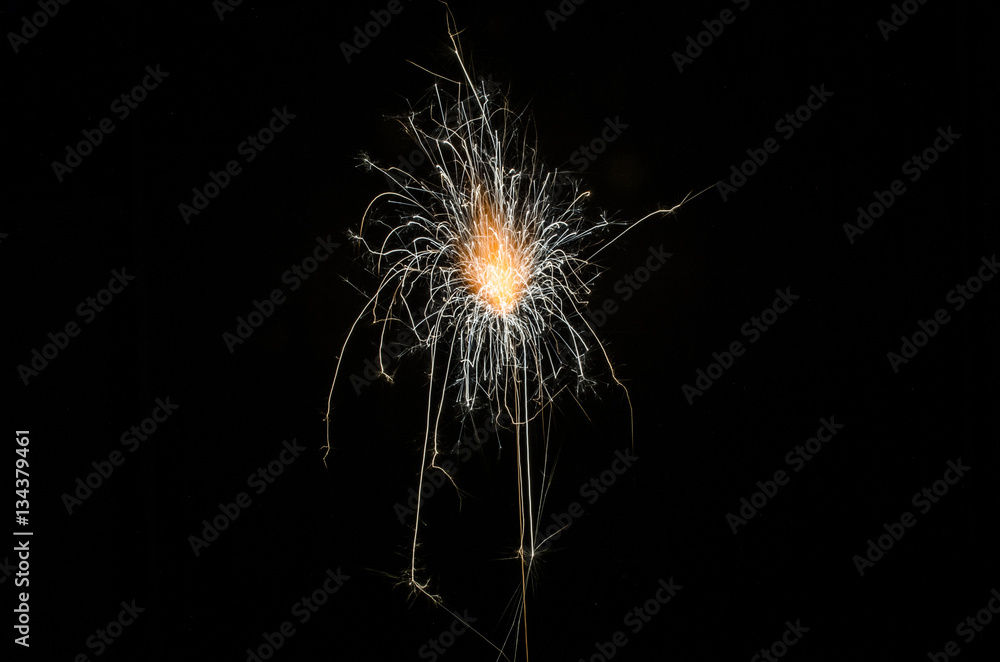 Golden orange amazing fireworks isolated in dark background close up, New Year, explode