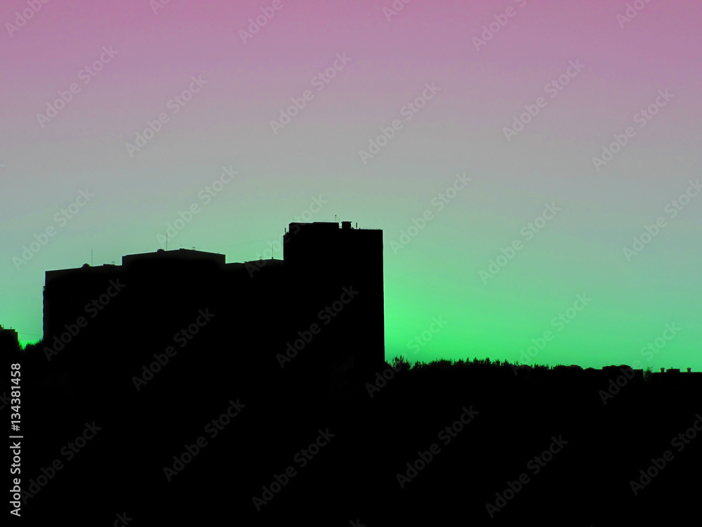 Silhouette of the house at sunset, dawn sky background