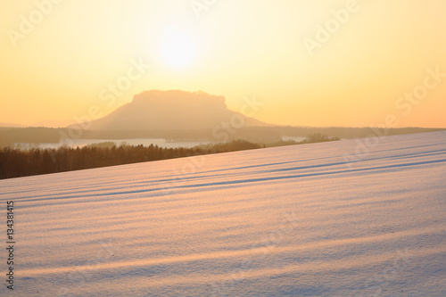 Lilienstein in Saxon Switzerland in winter at sunset 