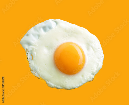 fried egg on yellow background