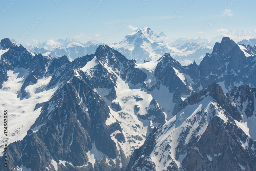 Peaks on the Montblanc mountains in summer, full of snow Peaks on the Montblanc mountains in summer, full of snow