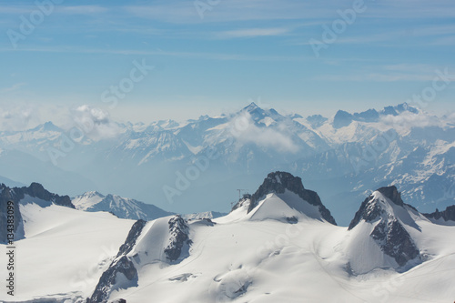 Peaks on the Montblanc mountains in summer, full of snow