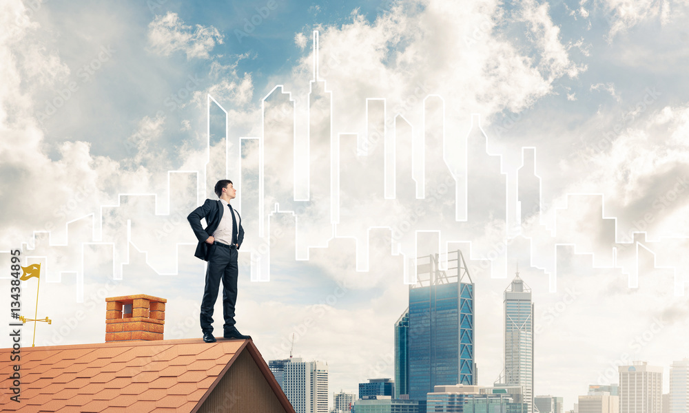 Mister boss on brick roof with arms akimbo. Mixed media Mister boss on brick roof with arms akimbo. Mixed media