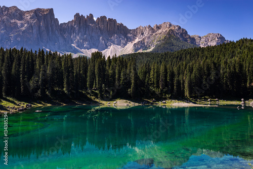 View of Karersee (Lago di Carezza), one of the most beautiful alpine lakes in the Italian Dolomites. © norbel