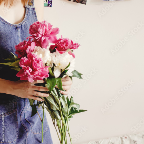woman hipster in denim dress holding peony bouquet in the mornin © sonyachny