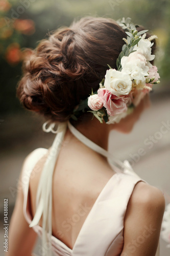 wedding hair style. luxury pink floral wreath on bride hair in