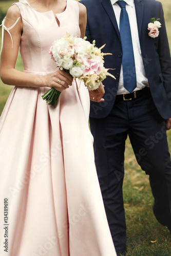 bride and groom hugging walking, holding hands, luxury wedding c