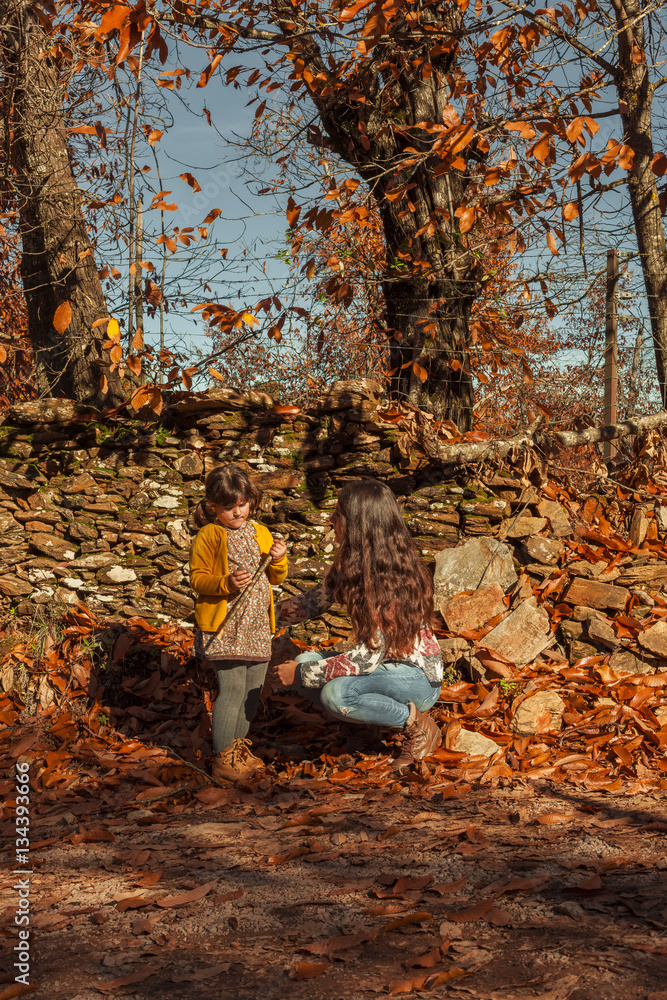 Portrait woman and girl admiring and enjoying nature. Autumn lan