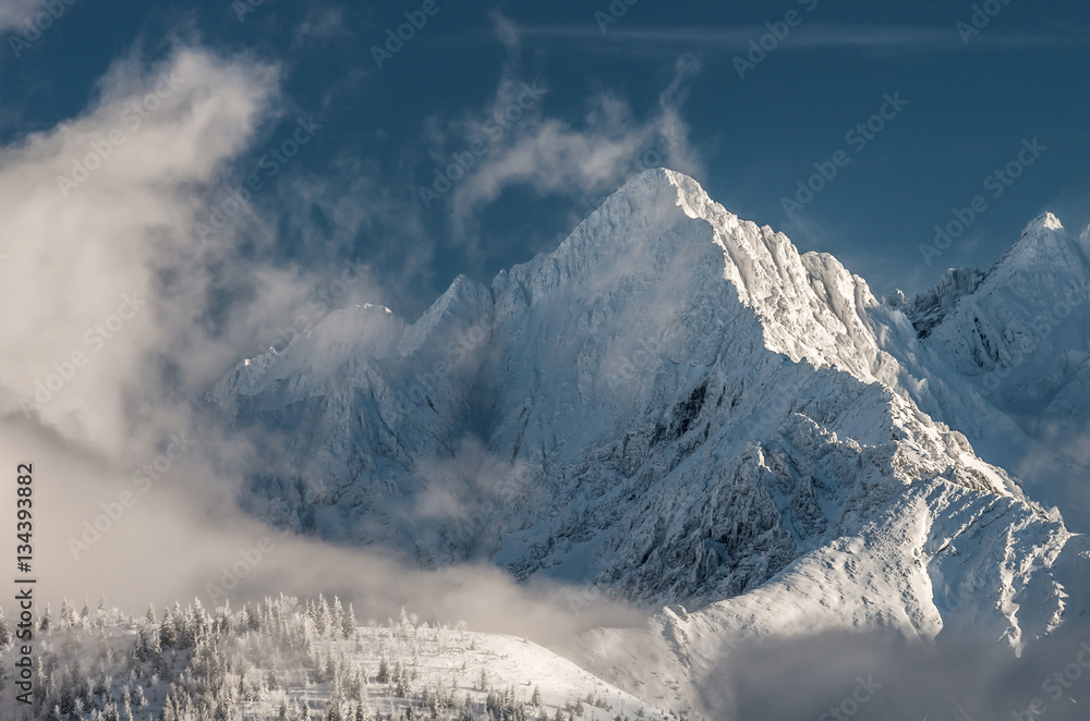 Tatra mountains in winter, Kolowy Szczyt in the clouds