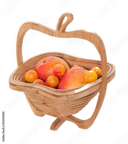 wooden basket witgh ripe fruites. photo